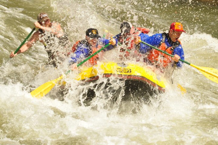 a man riding a wave on top of a body of water