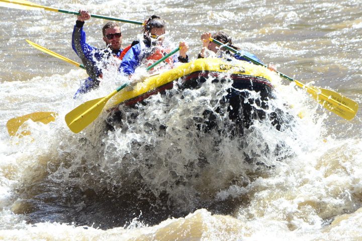 a man riding a wave on a surfboard in the water