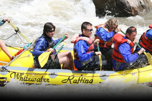 a group of people riding on the back of a boat