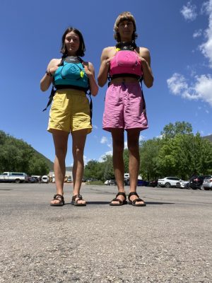 a group of people standing in a parking lot