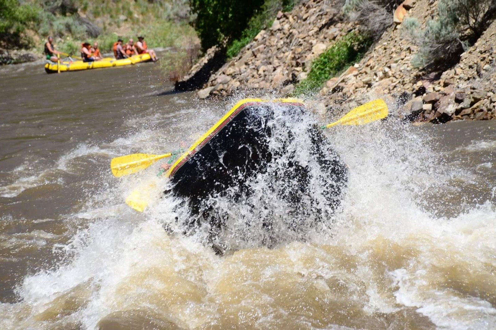 a man riding a wave on a surfboard in the water
