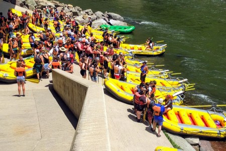 a group of people riding on the back of a boat