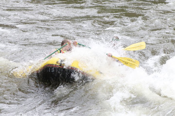 a man riding a wave on a surfboard in the water