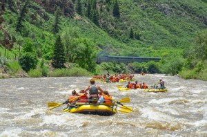 a group of people riding on the back of a boat