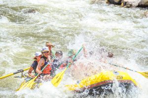 a man in a raft on the water